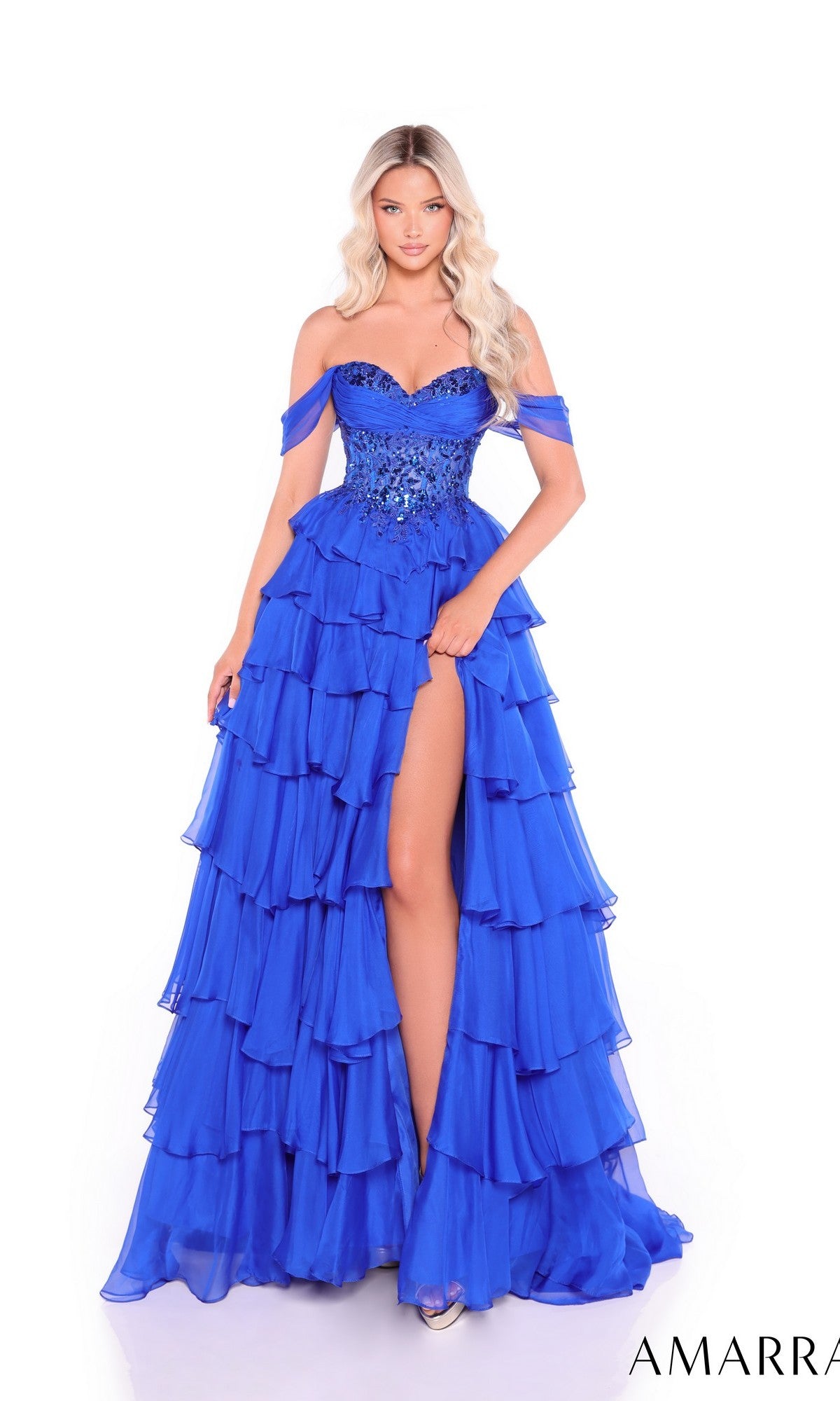 A woman in the stunning Amarra 89313 long blue sequin corset prom dress.